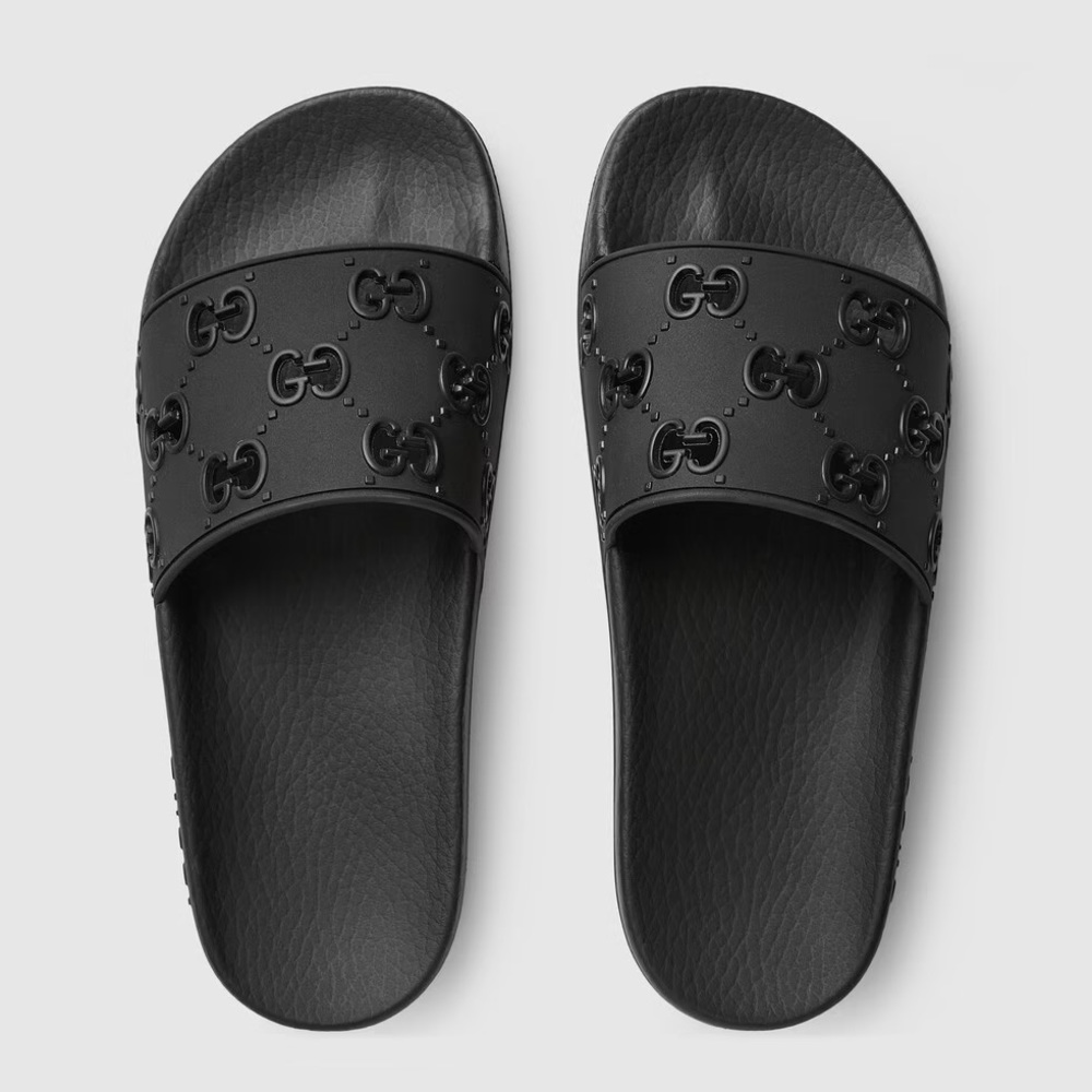 Women's Gucci rubber GG slide sandal
